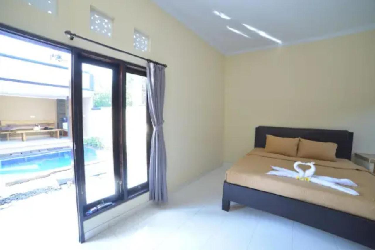 Oyo Flagship 91237 Ratu Guest House Kedunganan Esterno foto