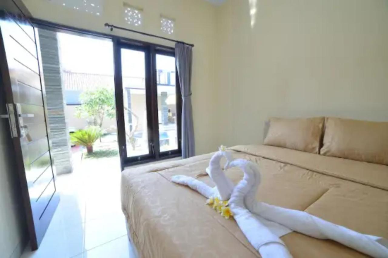 Oyo Flagship 91237 Ratu Guest House Kedunganan Esterno foto